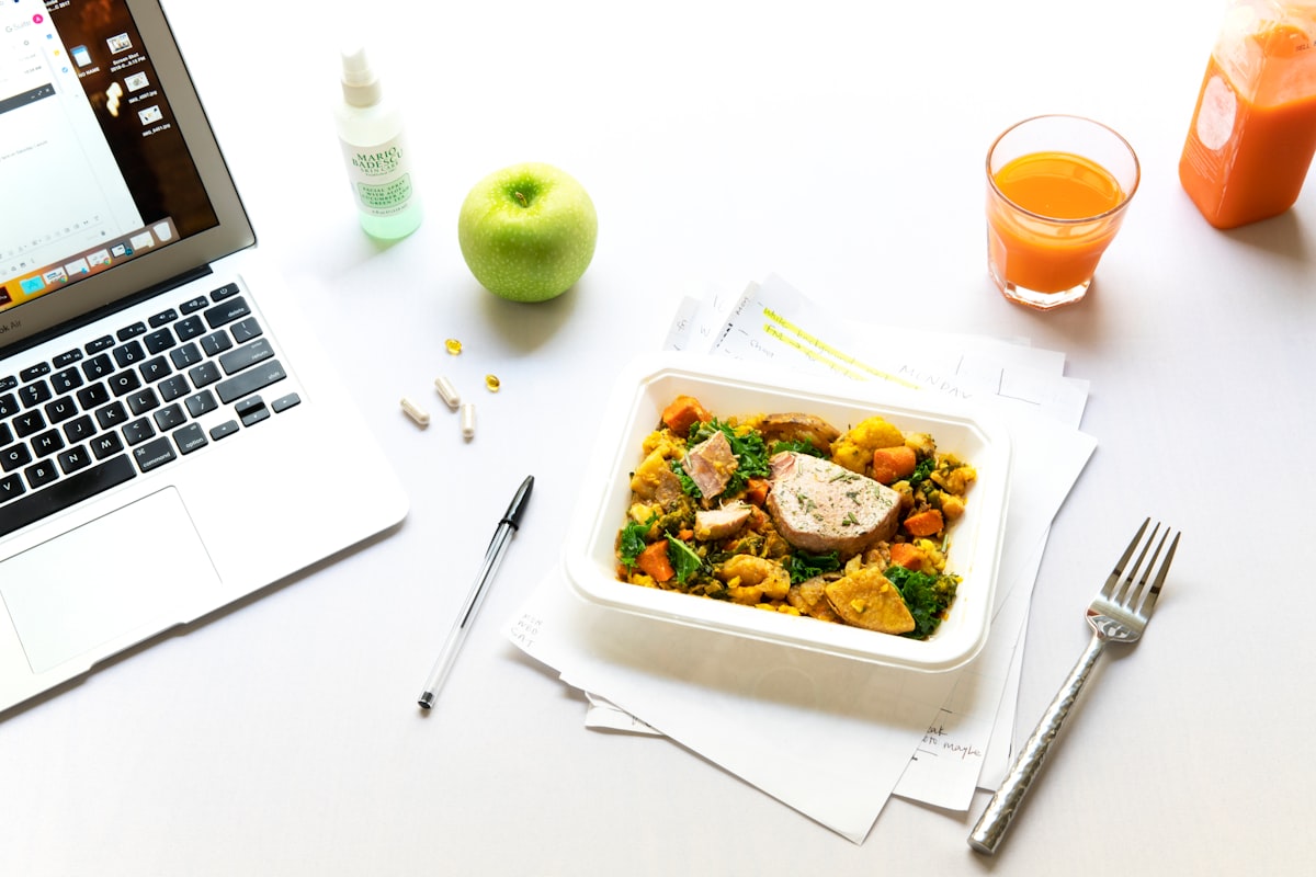 Nutritionist reviewing meal plans with client